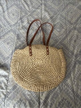 Payless’s Woven Straw Circle Tote with Brown Leather Straps